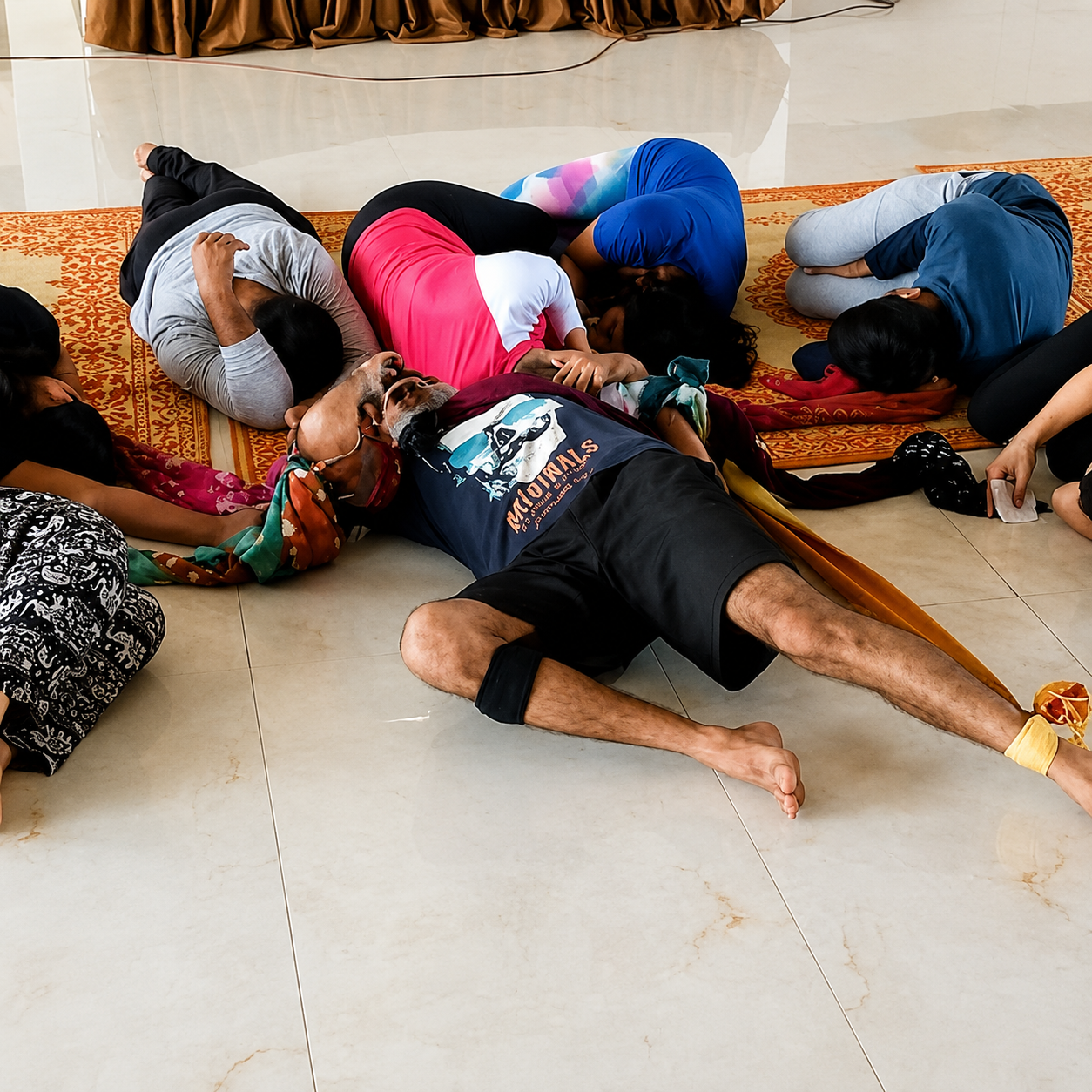Overhead view of trainees practicing an assisted pose together