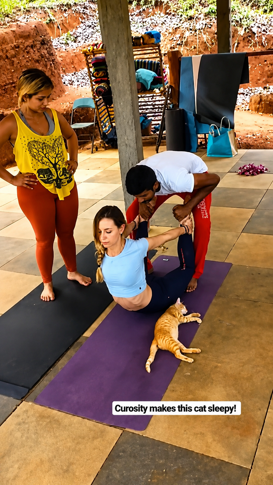Two trainees practicing a yoga pose together indoors