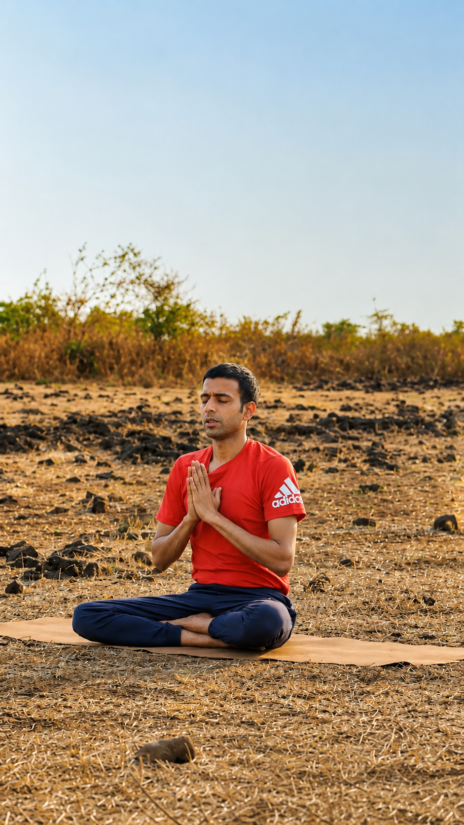 Amogh Shinde seated in meditation on the ground