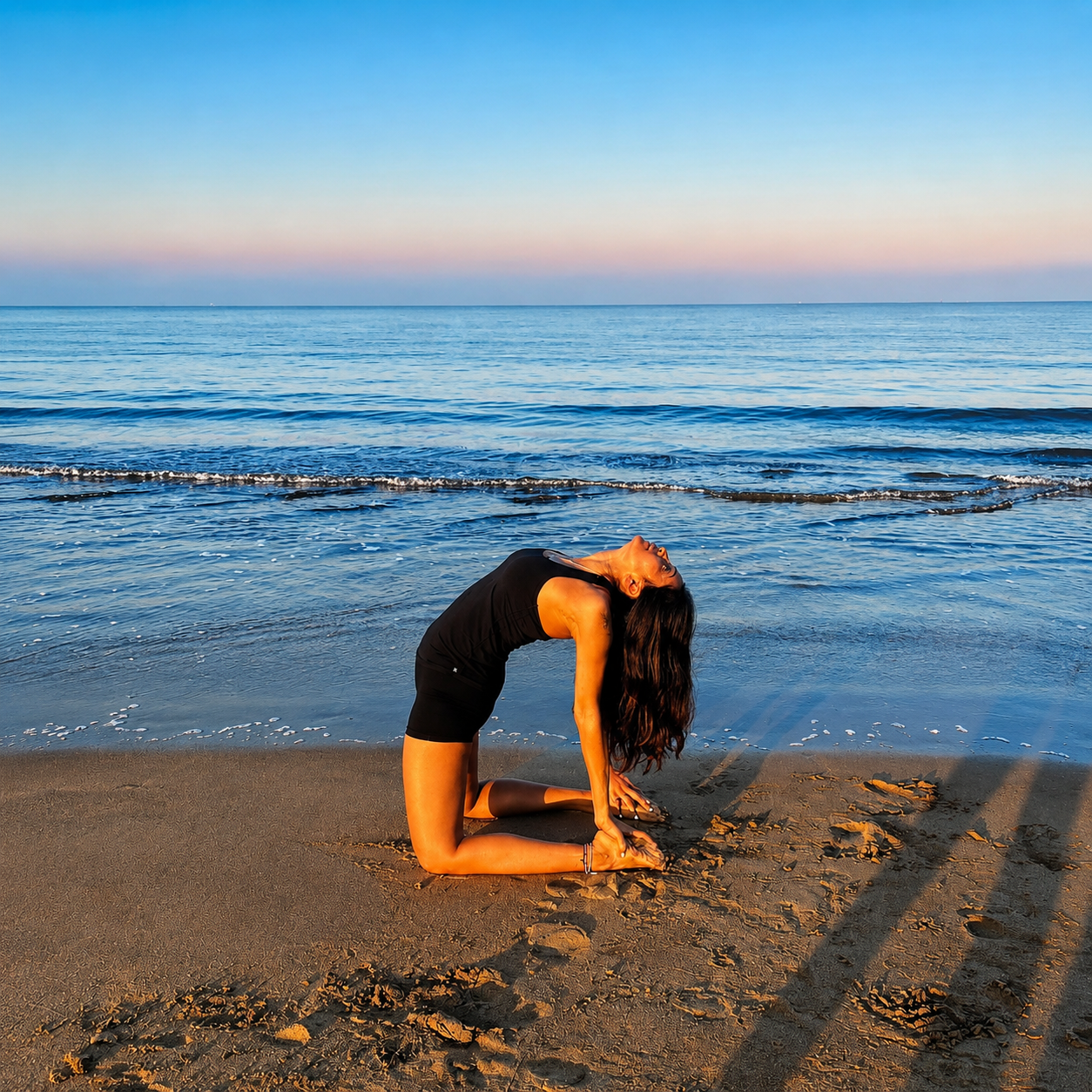 Kanika Karmakar in camel pose by the sea