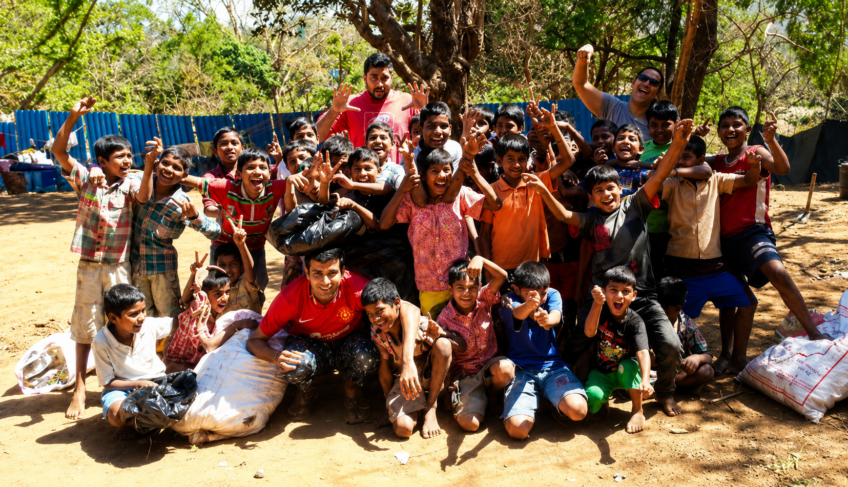 Group photo of volunteers and community members outdoors