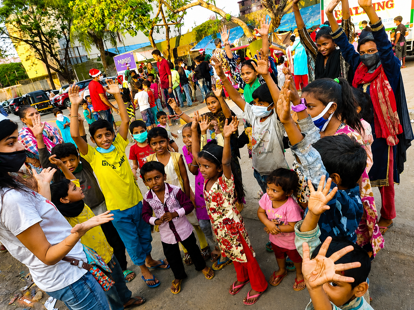 Volunteers distributing supplies to children in the community