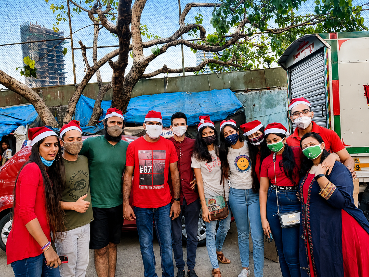 Volunteers posing together with community members