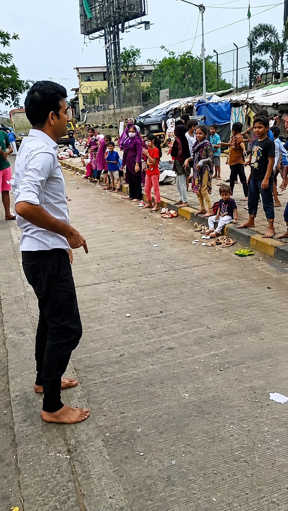 Volunteer walking through a crowded street during an outreach drive