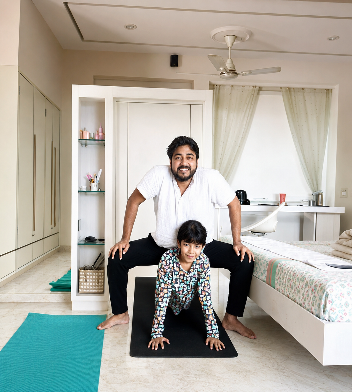 Father and child practicing a yoga pose together in the bedroom