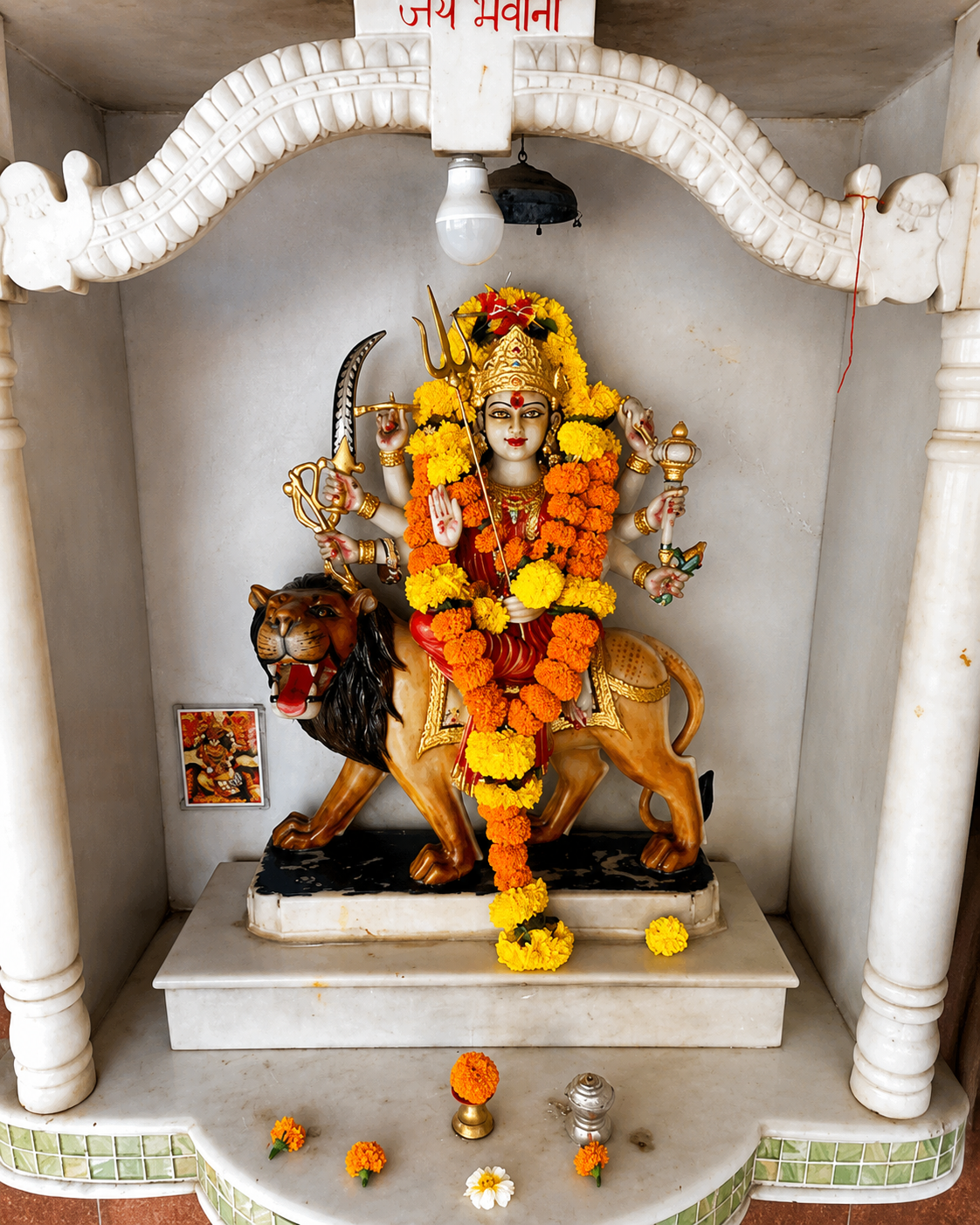 Ganesh idol shrine decorated for puja