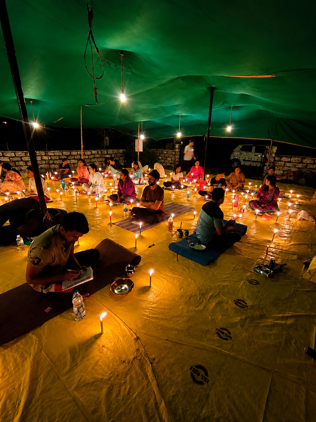 Group pranayama session in a softly lit hall